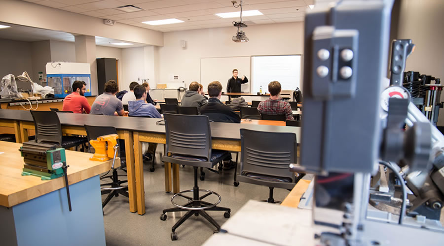 Students in a classroom setting focusing on a lecture