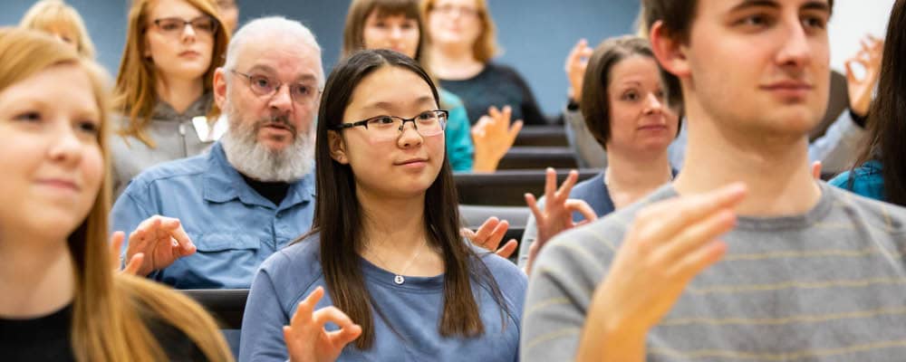 students signing during an ASL class